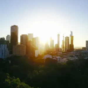 Sunset Aerial view of the Melbourne skyline with trees and Carlton Gardens Sunset Aerial view of the Melbourne skyline with trees and Carlton Gardens