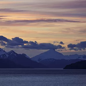 Sunset with Mountain Ranges Along Strait of Magellan, in South Americas Southern Tip