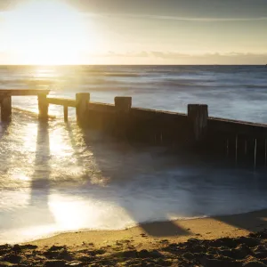 Sunset view of pier ruins at Mentone beach, Melbourne