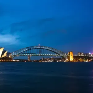 Sydney Harbour Bridge & Opera illuminated at dusk Sydney Harbour Bridge & Opera illuminated at dusk