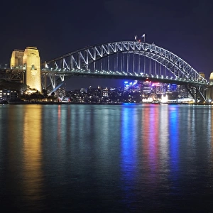 Sydney harbour bridge in Sydney harbour at night