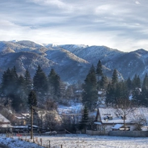 Transylvanian Alps and small village in winter