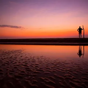 Tribal pose at the beach