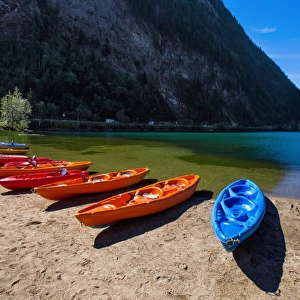 View of Three Valley Lake in Three Valley Gap with a Row of Canoes on the Trans-Canada Highway, British Columbia, Canada
