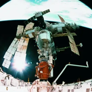 View from a wide angle lenses of a space station docking in orbit View from a wide angle lenses of a space station docking in orbit
