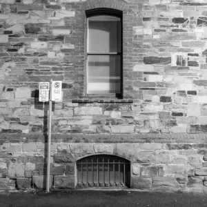 Side wall of building with air vent, window & sign Side wall of building with air vent, window & sign