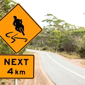 Warning sign for motor bikes. Tasmania. Australia Warning sign for motor bikes. Tasmania. Australia