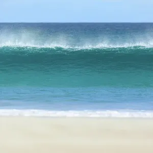 Wave breaking onto a beach. Sleaford Bay. Eyre Peninsula. South Australia Wave breaking onto a beach. Sleaford Bay. Eyre Peninsula. South Australia