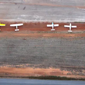 White Planes on Red Dirt Airstrip from Above