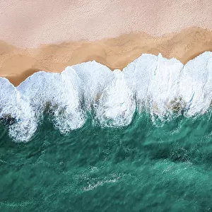 White waves washing the beach