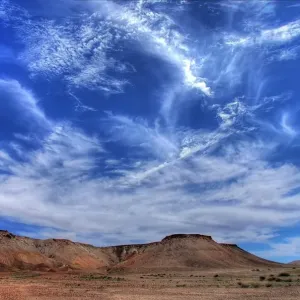 Wispy clouds over desert Wispy clouds over desert