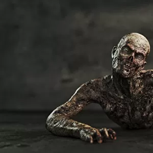 Zombie man crawling on floor