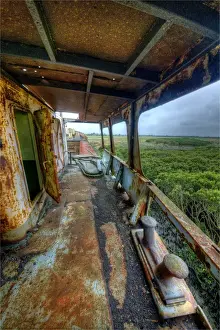 An abandoned and derelict old fishing Trawler lies deep in mangrove swamps near Tooradin, Western-port bay, Victoria