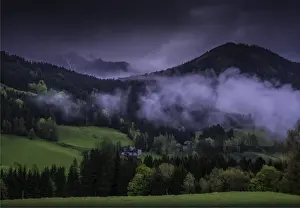 The Admont Valley in spring, with farmland pastures and mountain views, central Austria