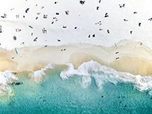 Felix Cesare Collection: An aerial beach shot of people sitting on the beach