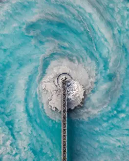 Aerial image showing swirling water patterns at a waste management facility, Arizona