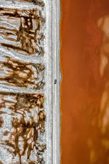 Images Dated 2020 March: Aerial shot of an dirt track and a truck alongside vibrant coloured salt ponds