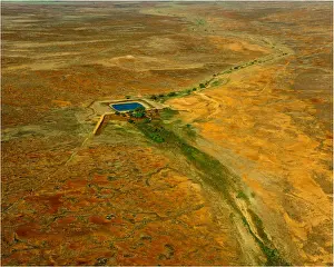 An Aerial view of the Australian outback, showing the vibrant colours of the Landscape