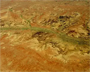 An Aerial view of the Australian outback, showing the vibrant colours of the Landscape