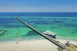 Building Exterior Prints: Aerial view of Busselton Jetty on a sunny day with tourists in front of souvenir shop in