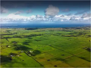 Aerial view of the green undulations and Bass Strait coastline, King Island, Tasmania
