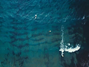 Ocean Wave Aerials Collection: Aerial view of a group of surfers. Abstract Background