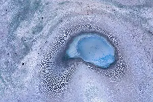 Aerial view of Patterns in the dry cracked soil of drought conditions over farming lands