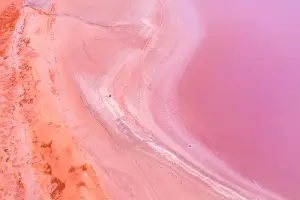 Aerial view of patterns, textures and colors, pink, purple and orange over a Pink Lake