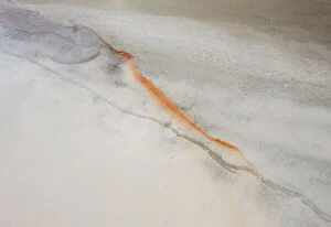 Images Dated 29th May 2021: Aerial view point over white and grey colored salt lake with orange line of color