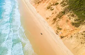 Vicki Smith Australian Landscape Photography Prints: Aerial view of sand dunes with vehicles travelling along the sand and the ocean