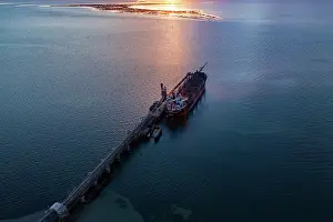 : Aerial view of the sunsetting over Thevenard Jetty