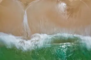 Images Dated 16th August 2019: Aerial view of turquoise water crashing onto a sandy beach - Long Exposure