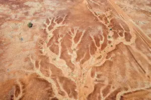 Aerial viewpoint looking down on the dry river beds and cracked earth of outback Australia