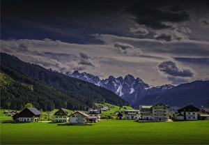 Alpine meadows and traditional buildings near Hallstatt, in the mountainous region of Salzkammergut, Austria Alpine meadows and traditional buildings near Hallstatt, in the mountainous region of Salzkammergut, Austria