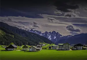 Alpine meadows and traditional buildings near Hallstatt, in the mountainous region of Salzkammergut, Austria