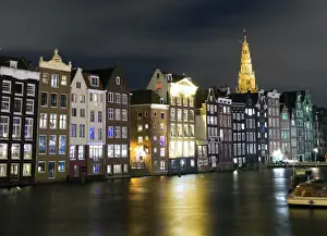Mariusz Kluzniak Prints: Amsterdam canal facing houses and Old church spire
