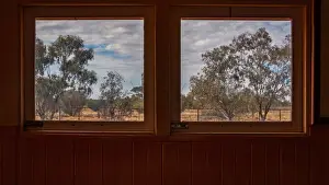 Prints of An arid landscape is visible through the windows of an old, woodden train Marianne Purdie Photography Prints: An arid landscape framed by train windows