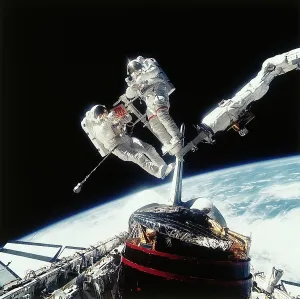 Space Suit Prints: Astronauts Holding 'For Sale' Sign in Space