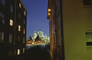Australia, Sydney, view of opera house between apartment buildings
