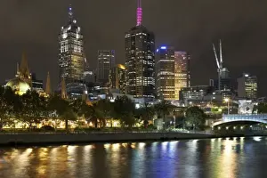 Australia, Victoria, Melbourne city skyline and Yarra River, night