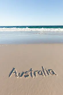 Coastal Prints: Australia written on a beach