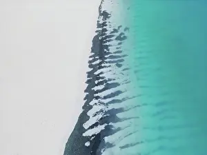 Abstract Aerial Art Prints: Bizarre patterns at the edge of a remote beach photographed from an aerial point of view