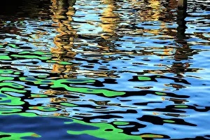 John White Photos Prints: Blue and green colours reflected in the sea at the commercial dock at the Port Lincoln Wharf