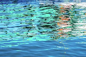 John White Photos Prints: Blue and green colours reflected in the sea at the commercial dock at the Port Lincoln Wharf
