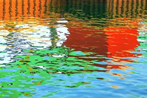 John White Photos Prints: Blue, green, red, orange and brown colours reflected in the sea at the commercial dock at the Port Lincoln Wharf