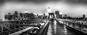 Brooklyn Bridge and Manhattan skyline under heavy fog in black and white Brooklyn Bridge and Manhattan skyline under heavy fog in black and white