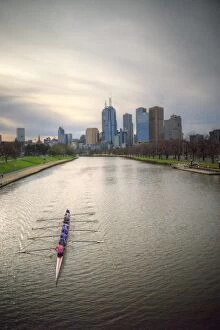 Images Dated 31st August 2014: Canoeing on river Yarra with Melbourne skyline
