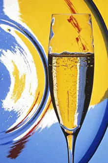 John W Banagan Prints: Champagne glass, colorful background
