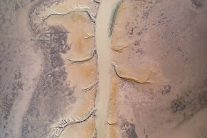 Images Dated 20th July 2023: Channel of water on the delta of the Fitzroy River seen from a birds-eye perspective, Derby