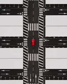 Close up drone shot of an abandoned airport parking terminal and a red car at the centre